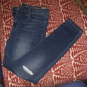 NWOT dark wash juniors jeans. Two knee rips